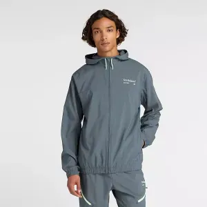 Campera New Balance Hombre Woven Graphic Jacket Gris